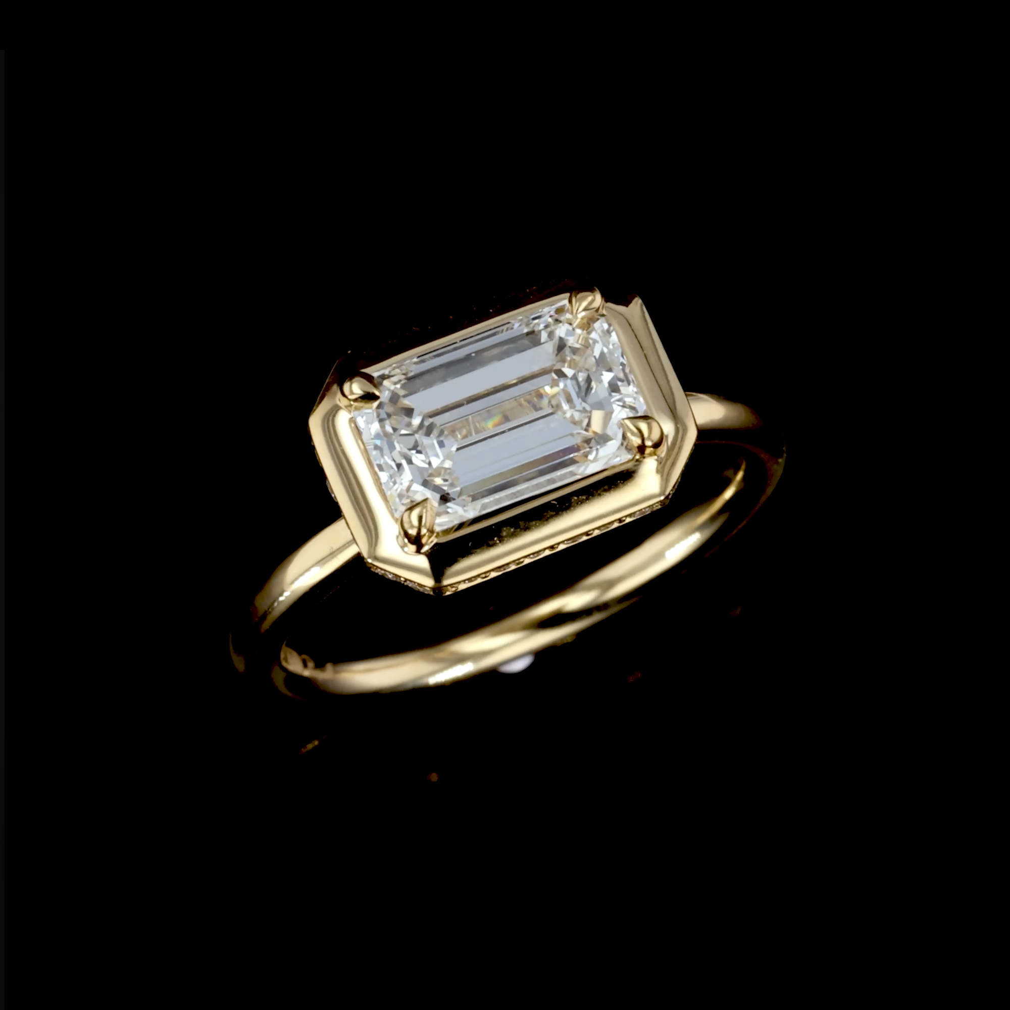 Skimming Stone Emerald Cut 2.01ct Diamond Ring in 18ct Yellow Gold