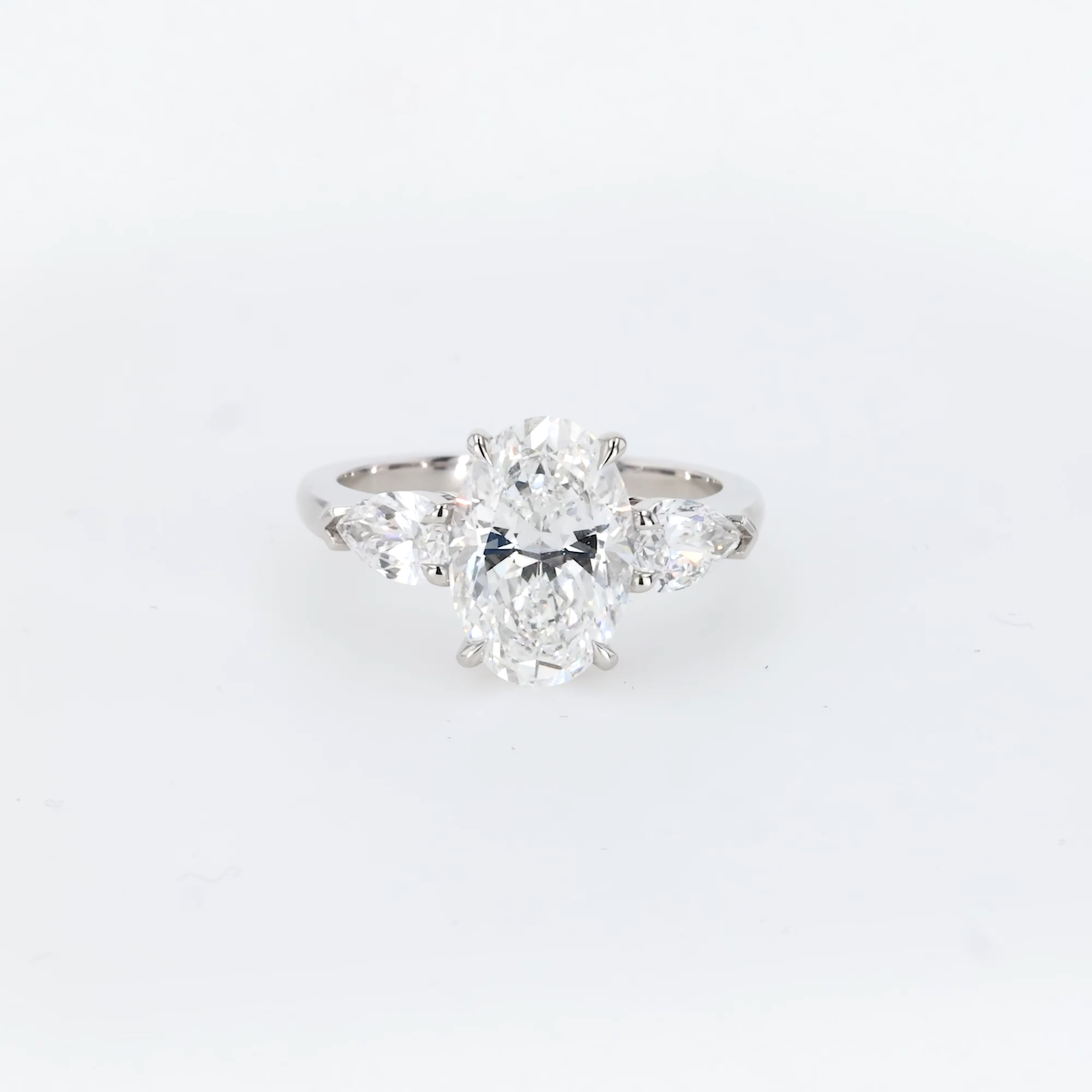 Classic 3.11ct Oval Cut Diamond Three Stone Ring in Platinum