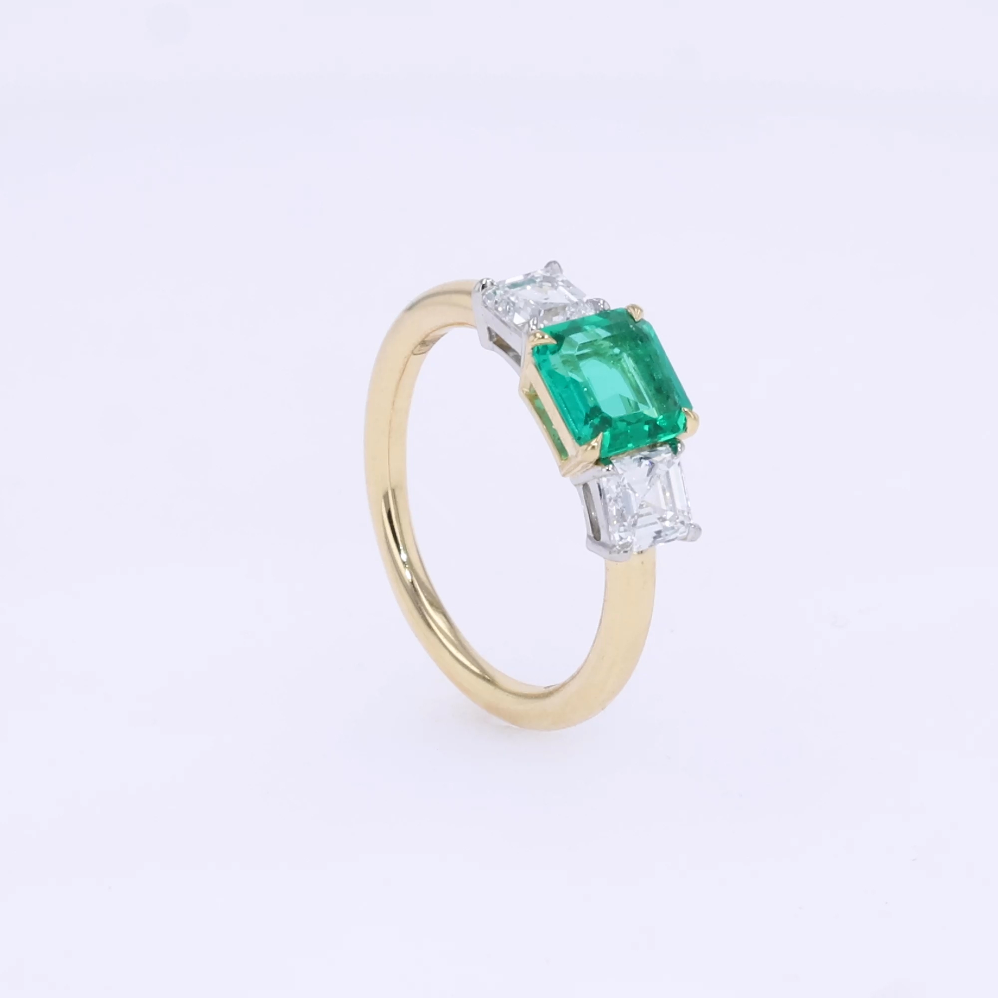 Three Stone Rectangular Cut Emerald Ring 2.03ct <br />  in Yellow Gold, with Carved Leaf Design Shank