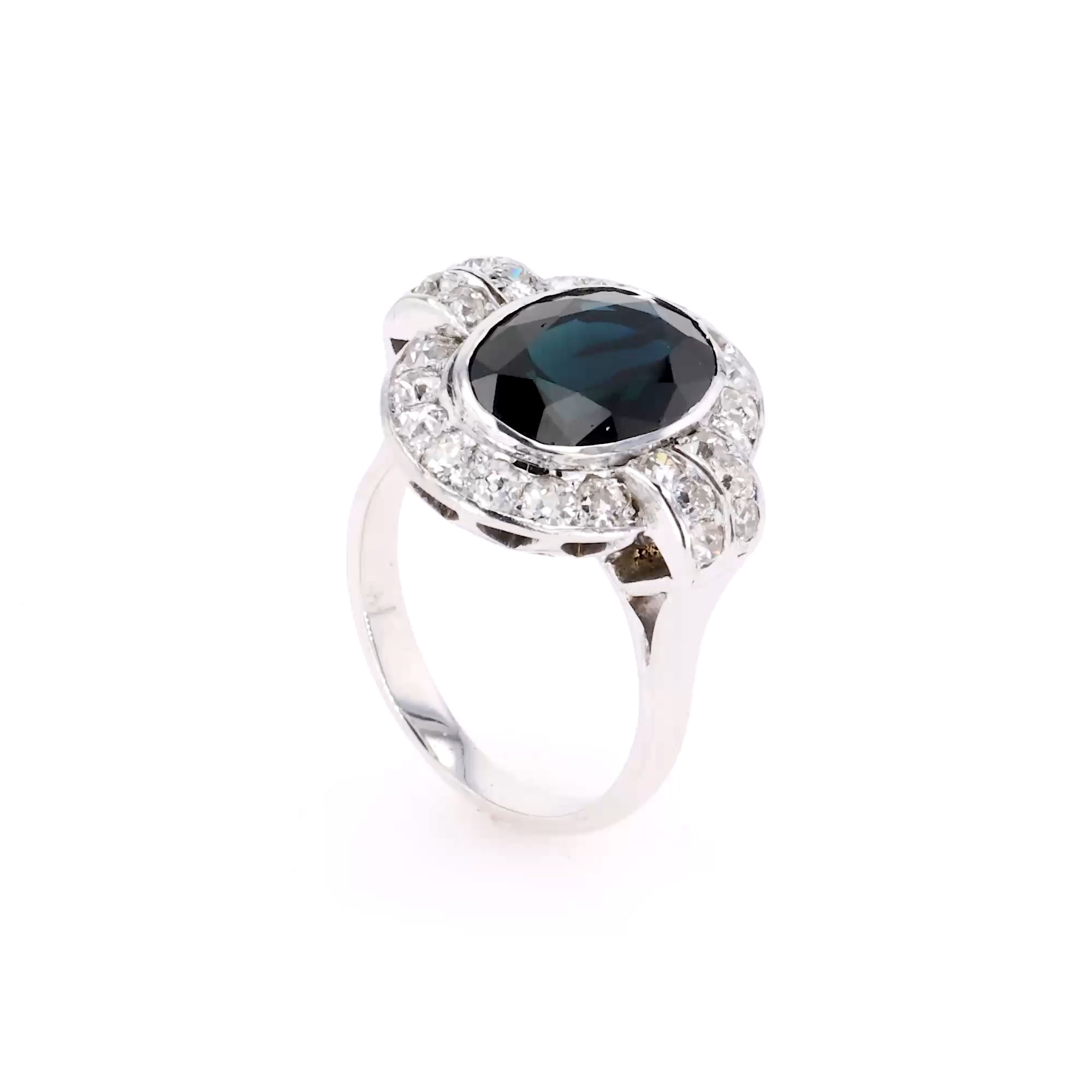Oval Cut Sapphire and Diamond Cluster Ring in 18ct White Gold