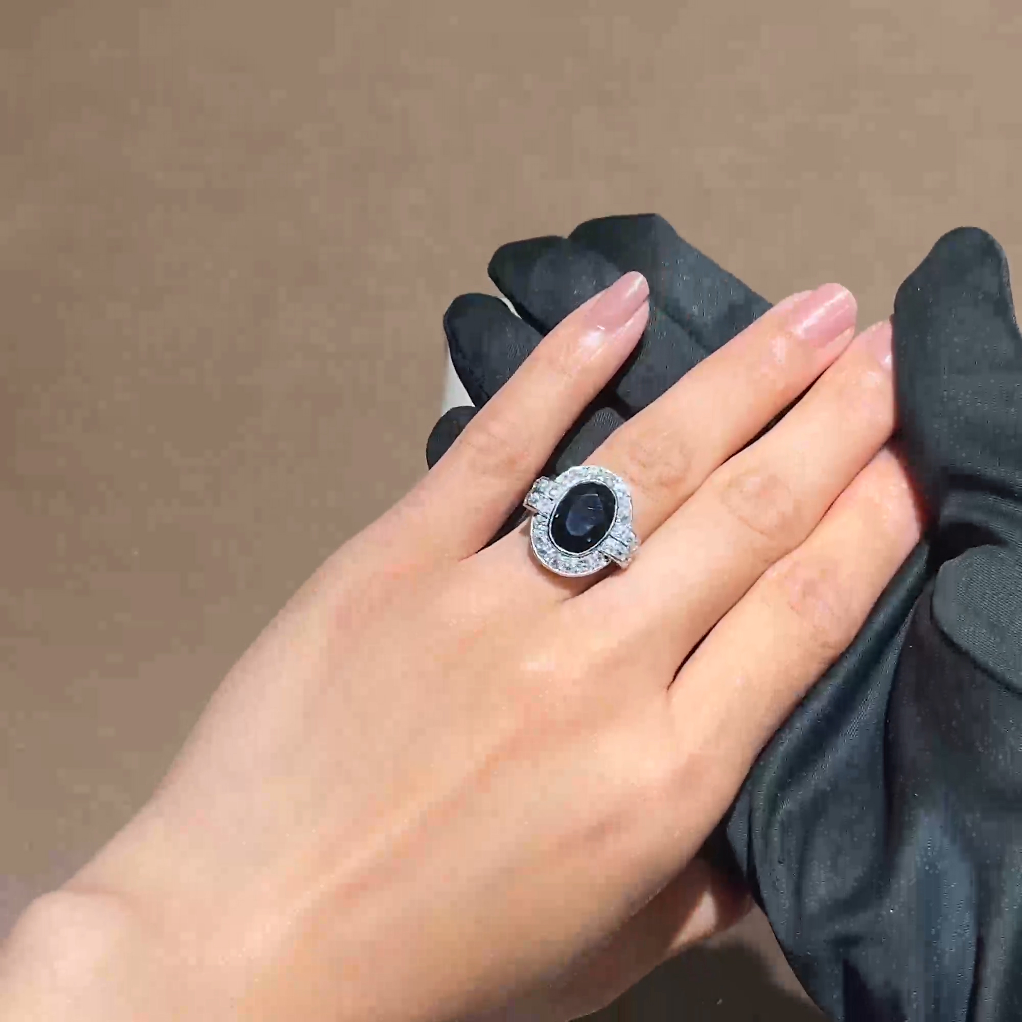 Oval Cut Sapphire and Diamond Cluster Ring in 18ct White Gold