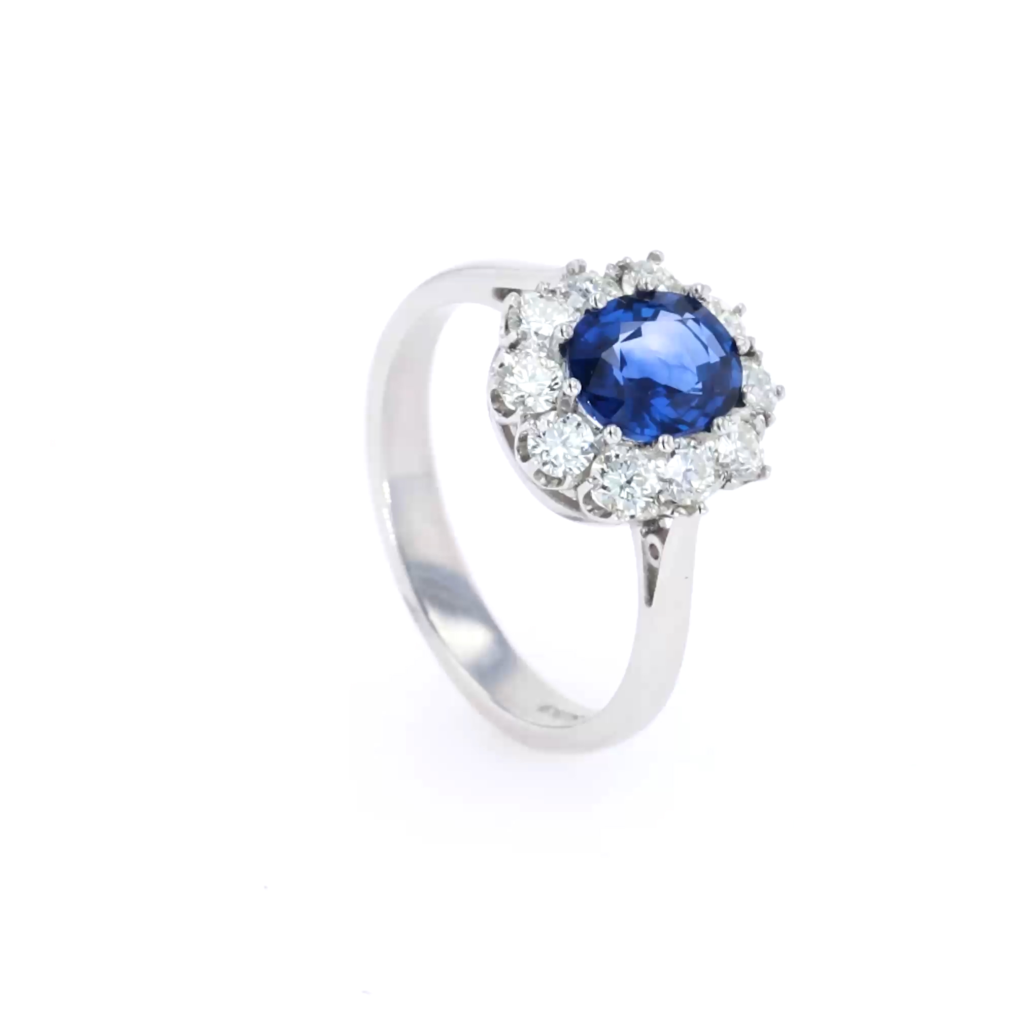 Oval Cut Sapphire and Diamond Cluster Ring in Platinum
