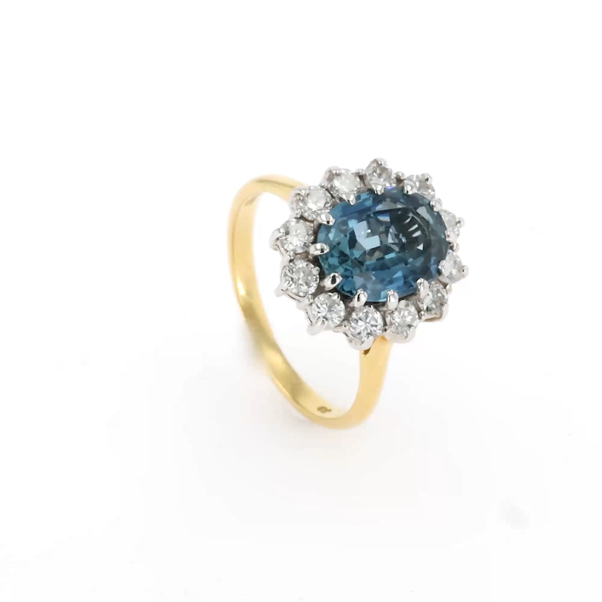 Oval Cut Aquamarine and Diamond Cluster Ring in 18ct Yellow Gold
