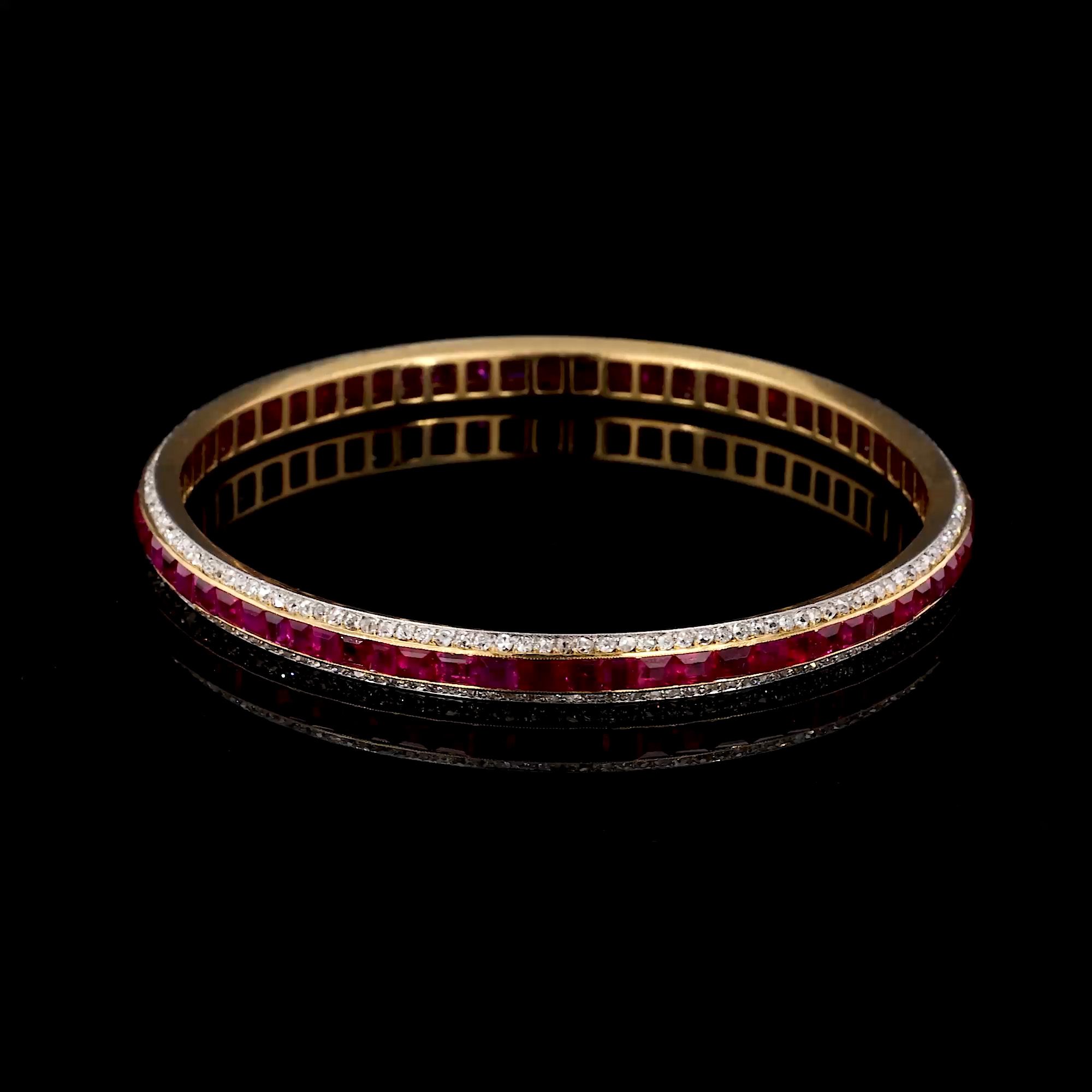 Victorian Calibre Cut Ruby and Diamond Bangle In Yellow Gold