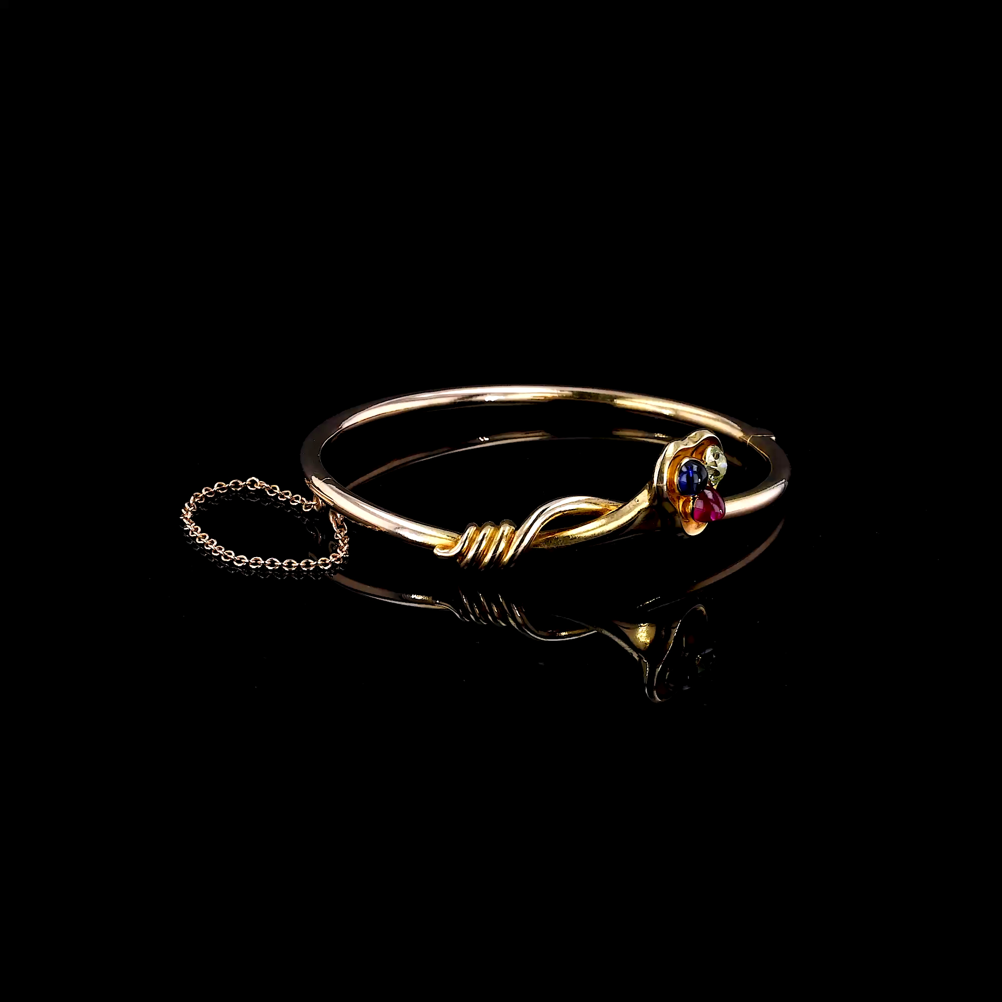 Edwardian ruby, sapphire & diamond hinged trefoil clover bangle in 14ct Yellow Gold