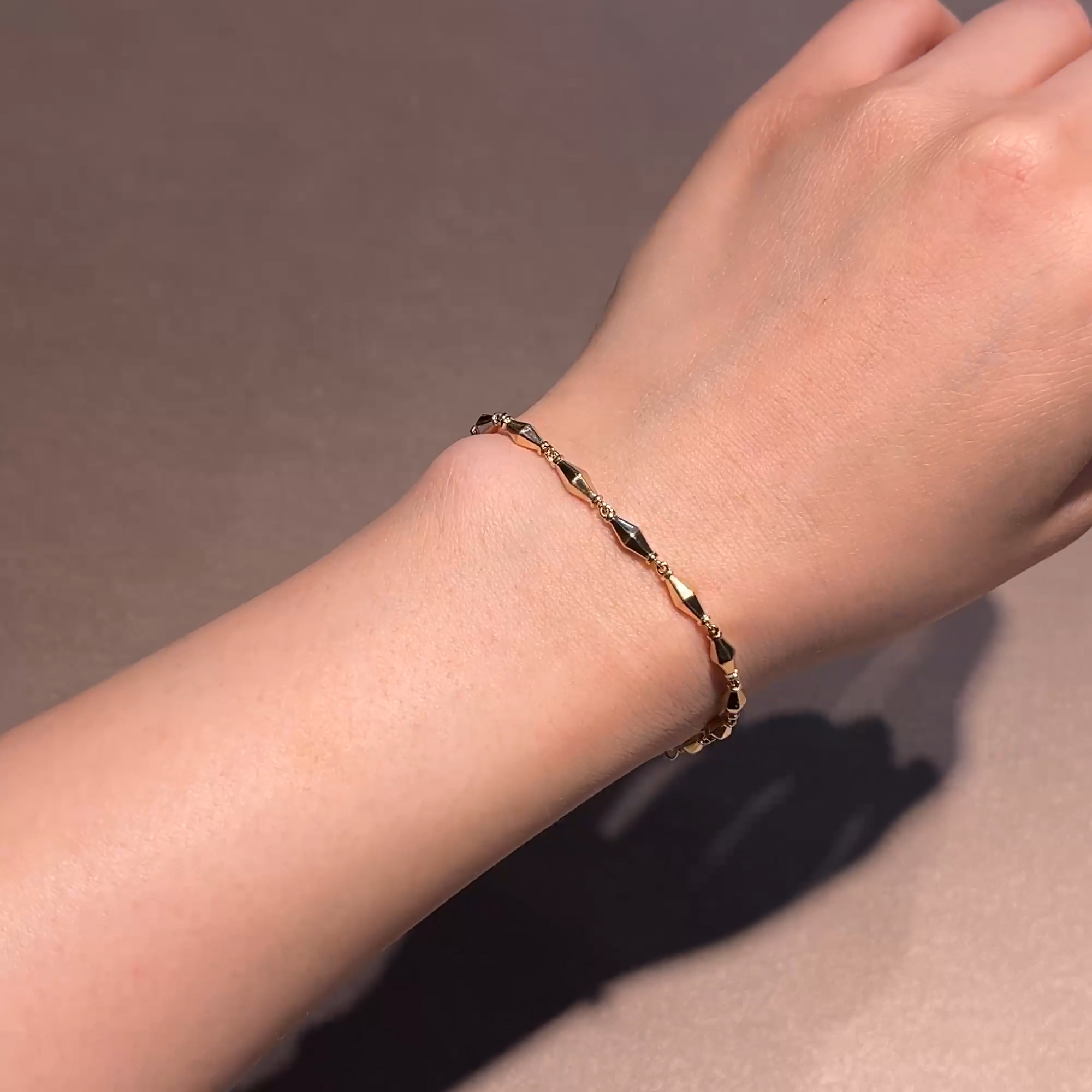 Cleopatra Gold Faceted Barrel Link Mini Bracelet in 18ct Yellow Gold