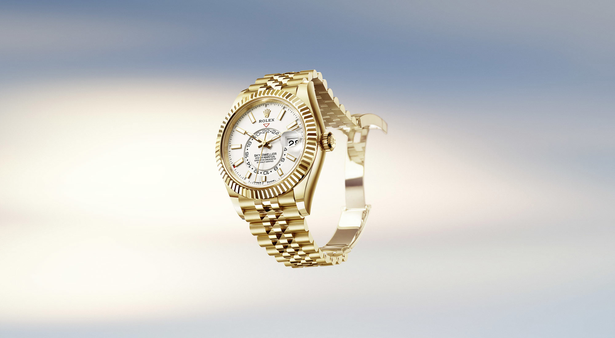 Rolex Sky Dweller with gold bracelet