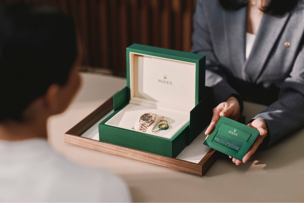 Rolex watch in presentation box with international guarantee card in boutique